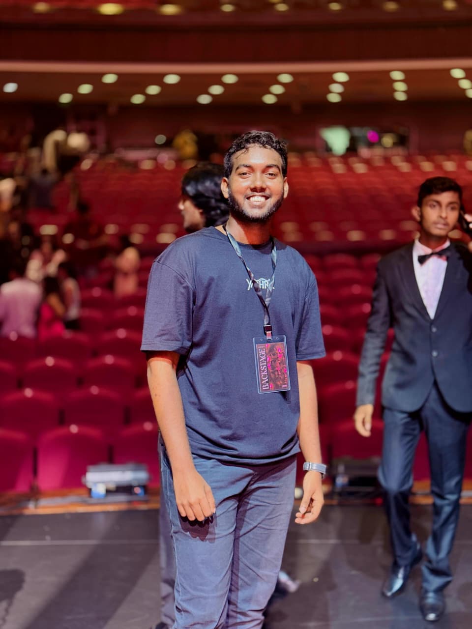 Dulaj Dineth backstage at Yathra 2026 with the crew pass