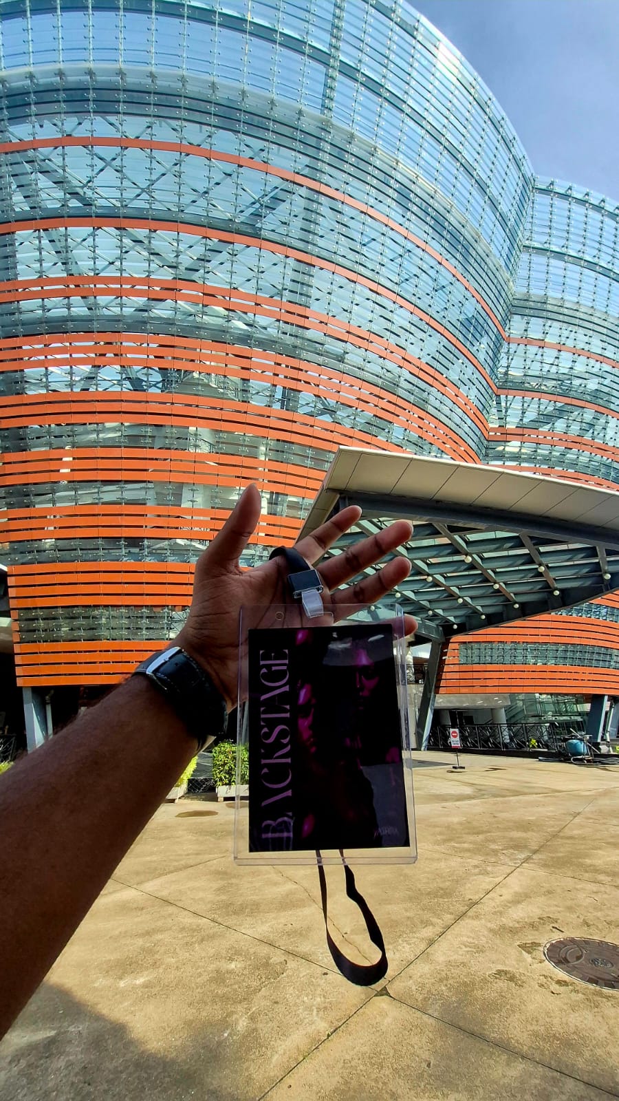 Yathra 2026 backstage crew pass held up at the venue