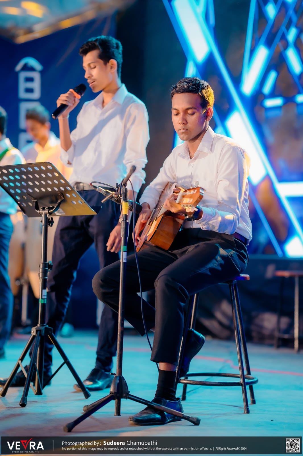 Playing guitar at a school event
